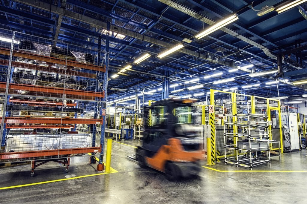 Blurred forklift in factory